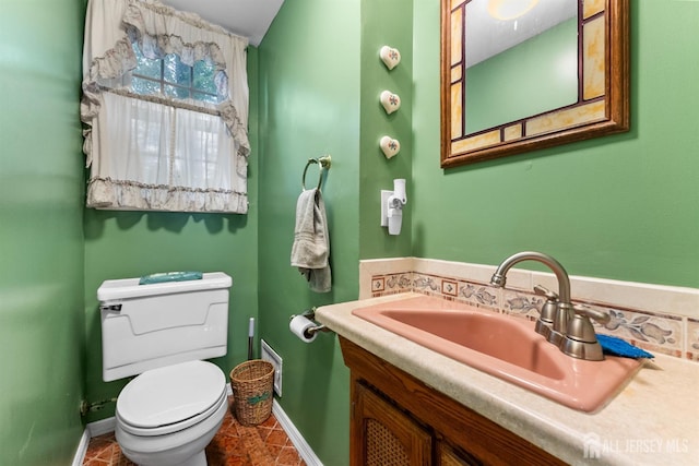 25 Turner Ave, Edison, NJ 08820 - bathroom with vanity, toilet, and baseboards