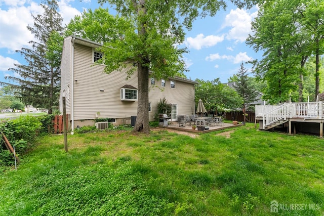 25 Turner Ave, Edison, NJ 08820 - back of property featuring a wooden deck and a patio area