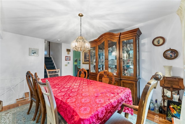 25 Turner Ave, Edison, NJ 08820 - dining area featuring a chandelier, stairs, and wood finished floors