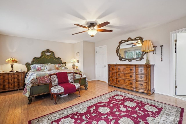 bedroom with hardwood / wood-style flooring and ceiling fan