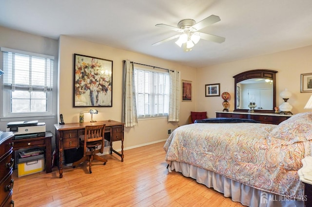 bedroom with ceiling fan and light wood-type flooring