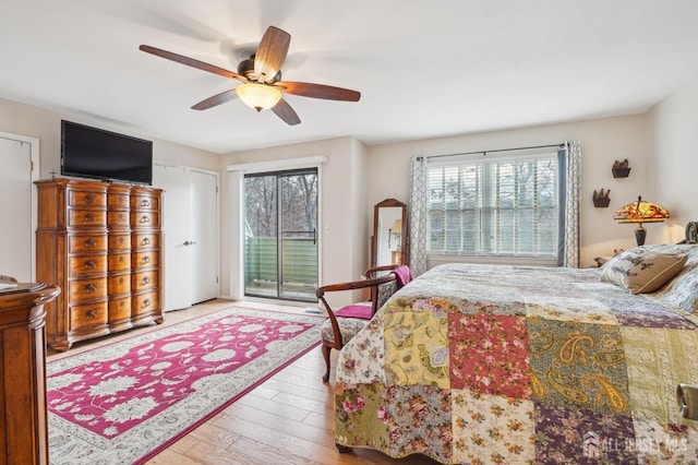 bedroom with light wood-type flooring, ceiling fan, access to exterior, and multiple windows