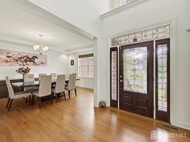 6 Condor Ct, South Brunswick, NJ 08852 - entrance foyer featuring a chandelier, wood finished floors, crown molding, and baseboards