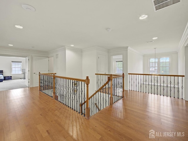 6 Condor Ct, South Brunswick, NJ 08852 - hallway with wood finished floors, ornamental molding, an upstairs landing, healthy amount of natural light, and recessed lighting