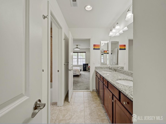 6 Condor Ct, South Brunswick, NJ 08852 - ensuite bathroom featuring double vanity, tile patterned floors, baseboards, and recessed lighting