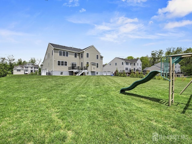 6 Condor Ct, South Brunswick, NJ 08852 - rear view of property with a playground and a yard
