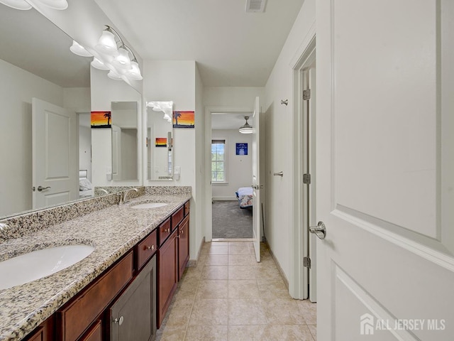 6 Condor Ct, South Brunswick, NJ 08852 - ensuite bathroom featuring tile patterned flooring, double vanity, and baseboards