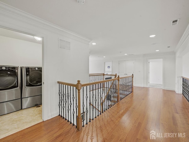 6 Condor Ct, South Brunswick, NJ 08852 - corridor with washer and clothes dryer, an upstairs landing, ornamental molding, wood finished floors, and recessed lighting