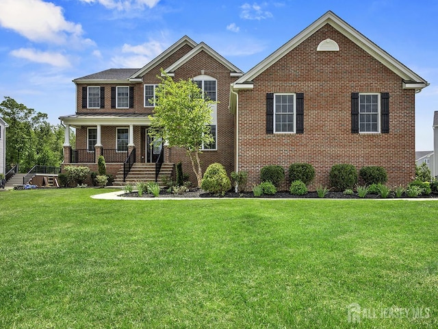 6 Condor Ct, South Brunswick, NJ 08852 - view of front of home featuring brick siding, a front lawn, and stairway