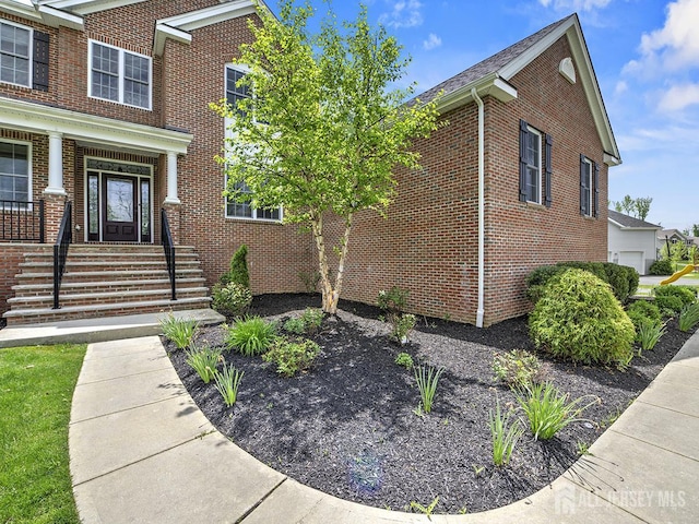 6 Condor Ct, South Brunswick, NJ 08852 - view of side of property with brick siding and a porch