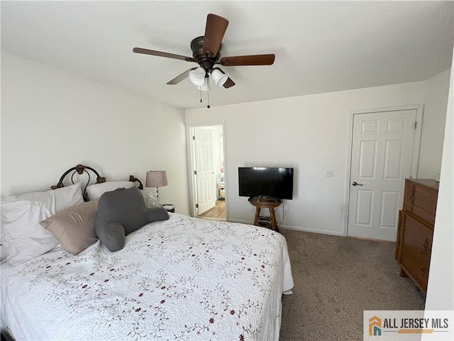 bedroom with ceiling fan, baseboards, and carpet