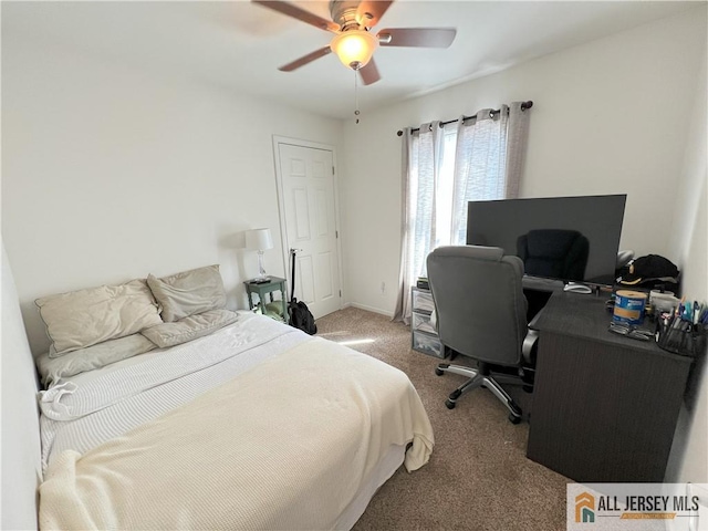 carpeted bedroom with baseboards and ceiling fan