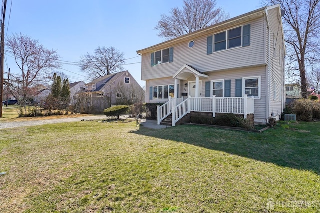 colonial inspired home with a front lawn and central AC