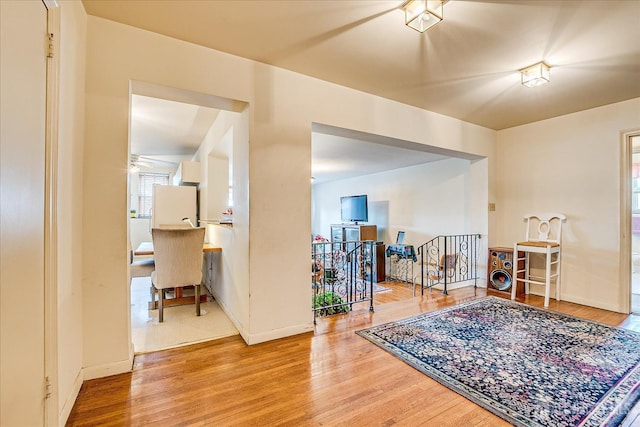 19-31 Lyons Ave, Newark, NJ 07112 - entryway with wood finished floors, a ceiling fan, baseboards, and plenty of natural light