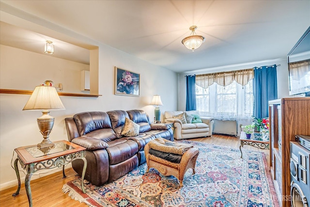 19-31 Lyons Ave, Newark, NJ 07112 - living area featuring wood finished floors and stacked washer and clothes dryer