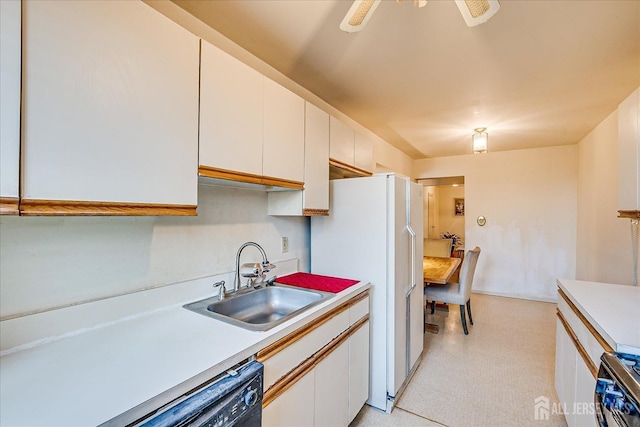 19-31 Lyons Ave, Newark, NJ 07112 - kitchen with a sink, electric stove, light countertops, and white cabinetry