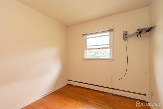 140 Prospect Plains Rd, Monroe, NJ 08831 - spare room featuring a baseboard heating unit and light wood-type flooring