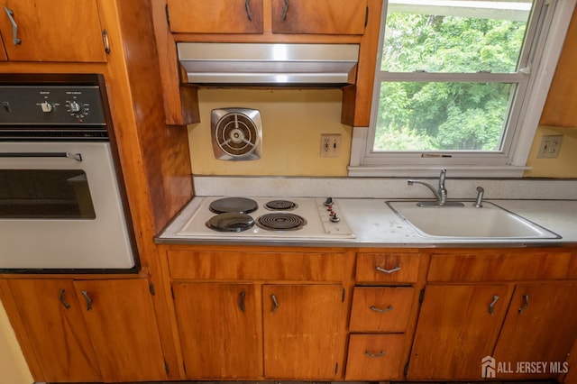 140 Prospect Plains Rd, Monroe, NJ 08831 - kitchen with stainless steel oven, white electric stovetop, exhaust hood, and plenty of natural light