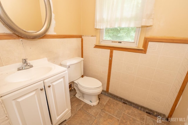 140 Prospect Plains Rd, Monroe, NJ 08831 - bathroom featuring tile walls, vanity, wainscoting, and tile patterned floors