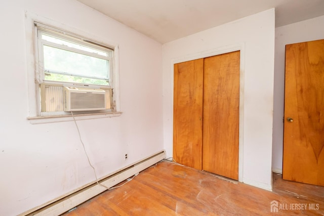 140 Prospect Plains Rd, Monroe, NJ 08831 - unfurnished bedroom with baseboard heating, a closet, and cooling unit