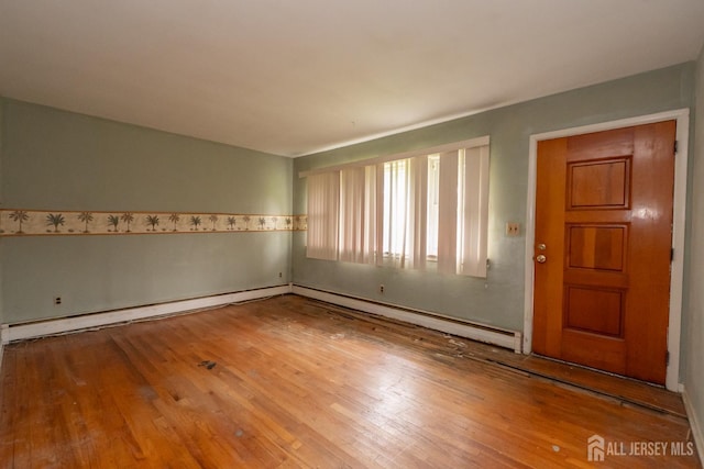 140 Prospect Plains Rd, Monroe, NJ 08831 - empty room featuring wood finished floors and baseboard heating