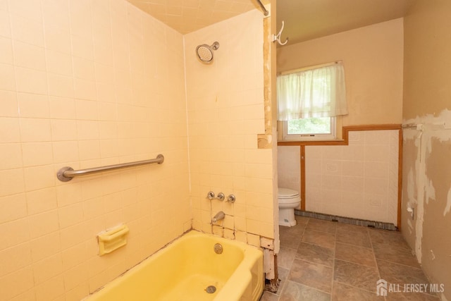 140 Prospect Plains Rd, Monroe, NJ 08831 - bathroom featuring tile walls,  shower combination, and a wainscoted wall