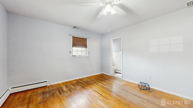 131 Hazelwood Ave, Metuchen, NJ 08840 - empty room with wood finished floors, a ceiling fan, and a baseboard heating unit