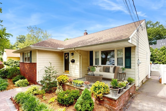 131 Hazelwood Ave, Metuchen, NJ 08840 - view of front of property featuring an outdoor hangout area, roof with shingles, and a chimney