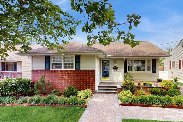 131 Hazelwood Ave, Metuchen, NJ 08840 - view of front facade with brick siding and roof with shingles