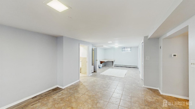 131 Hazelwood Ave, Metuchen, NJ 08840 - below grade area with a baseboard heating unit and light tile patterned flooring