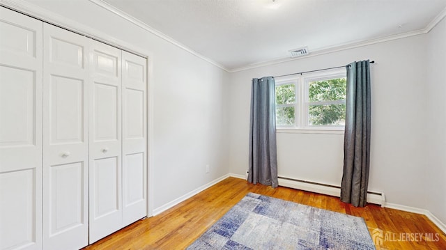 131 Hazelwood Ave, Metuchen, NJ 08840 - unfurnished bedroom featuring ornamental molding, light wood finished floors, a closet, and baseboard heating