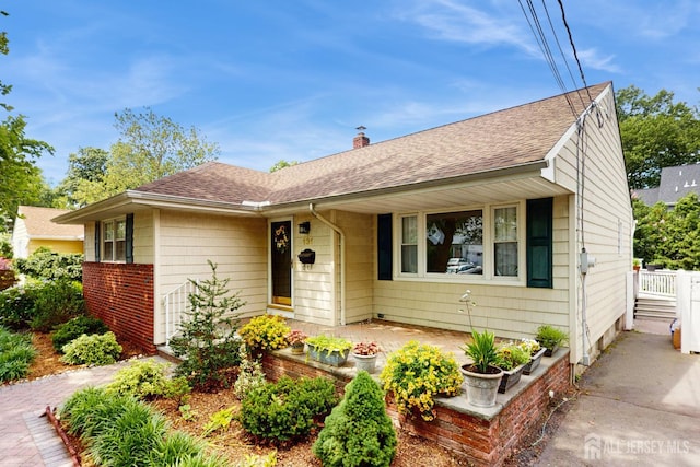 131 Hazelwood Ave, Metuchen, NJ 08840 - view of front of property featuring roof with shingles and a chimney