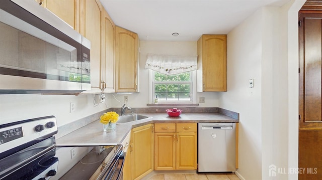 131 Hazelwood Ave, Metuchen, NJ 08840 - kitchen featuring appliances with stainless steel finishes and light brown cabinets