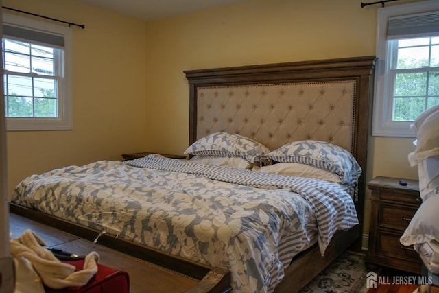 bedroom featuring multiple windows