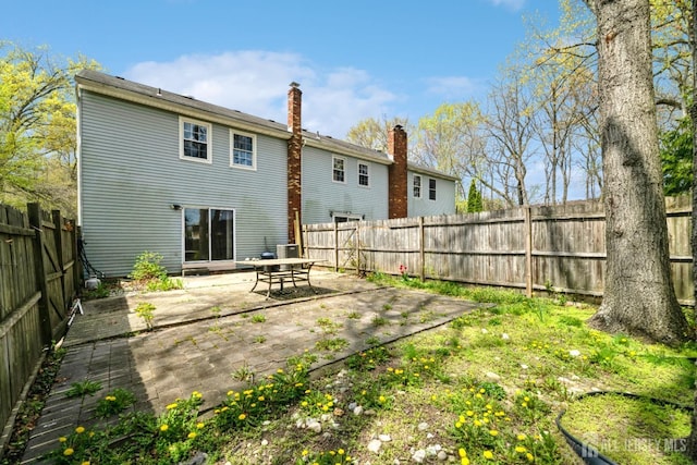44 Townsend Dr, Old Bridge, NJ 07747 - rear view of house with a patio, a fenced backyard, and central AC unit