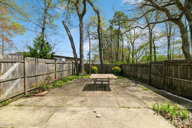 44 Townsend Dr, Old Bridge, NJ 07747 - view of patio featuring outdoor dining area and a fenced backyard