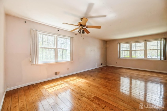 44 Townsend Dr, Old Bridge, NJ 07747 - unfurnished room with wood-type flooring, baseboards, and a ceiling fan