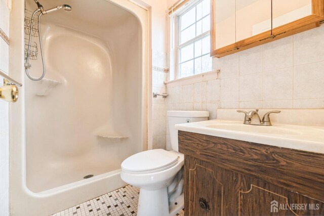 44 Townsend Dr, Old Bridge, NJ 07747 - full bath featuring tile walls, a shower stall, toilet, tile patterned floors, and vanity