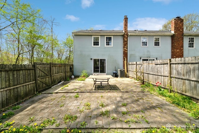 44 Townsend Dr, Old Bridge, NJ 07747 - back of property featuring a patio area, a fenced backyard, and central AC