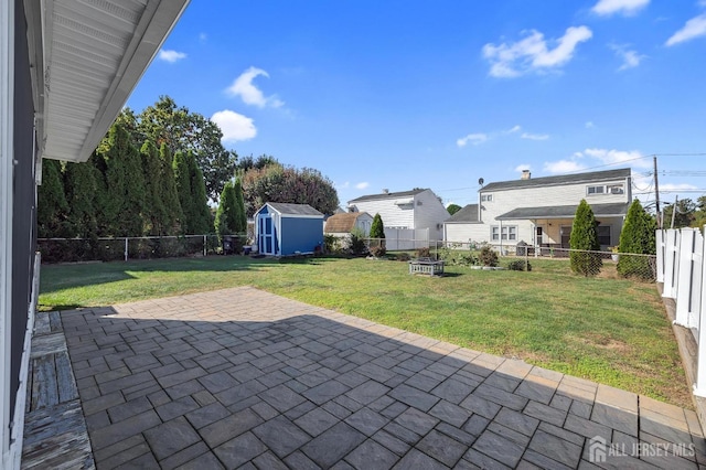 view of patio / terrace with a shed