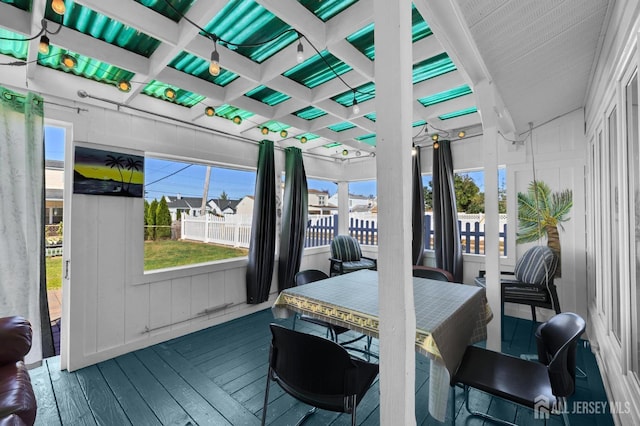 sunroom with beamed ceiling and coffered ceiling