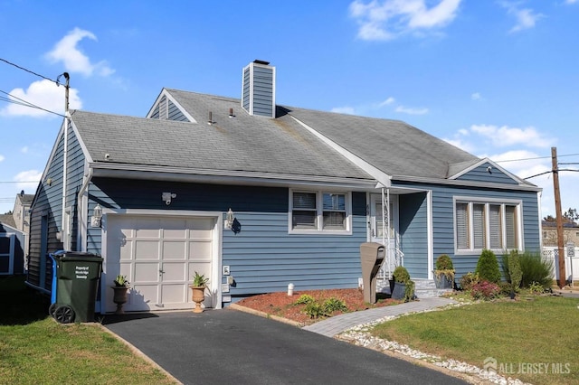 view of front facade with a front lawn and a garage