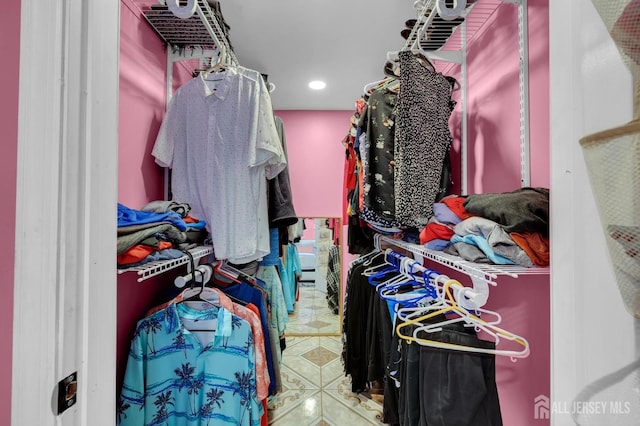 spacious closet with tile patterned floors