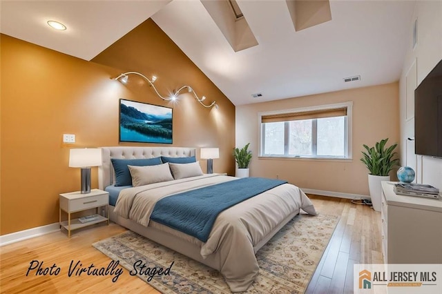 bedroom featuring baseboards, light wood-style flooring, vaulted ceiling, and recessed lighting