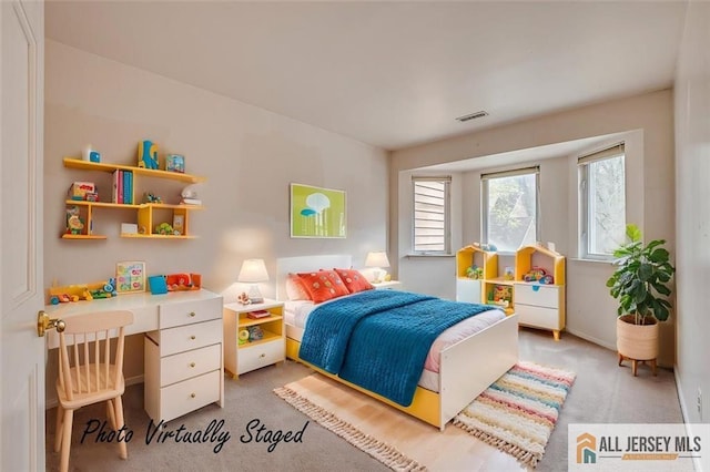 bedroom with light carpet
