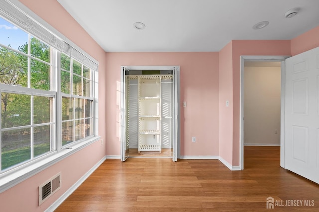 26 Jaime Ct, Old Bridge, NJ 08857 - unfurnished bedroom with light wood finished floors