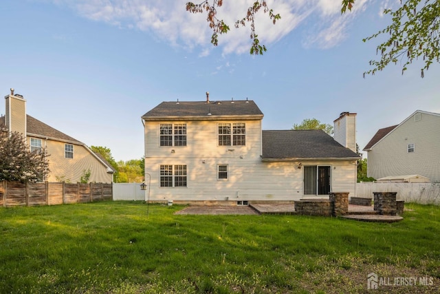 26 Jaime Ct, Old Bridge, NJ 08857 - back of house featuring a fenced backyard and a chimney