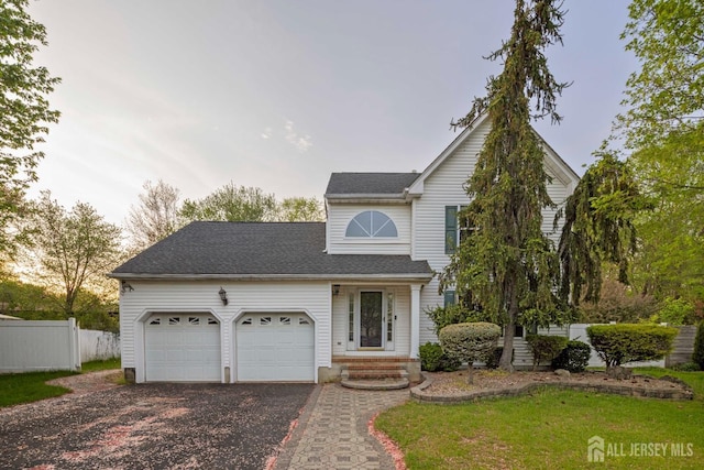 26 Jaime Ct, Old Bridge, NJ 08857 - traditional home featuring an attached garage, asphalt driveway, and a shingled roof