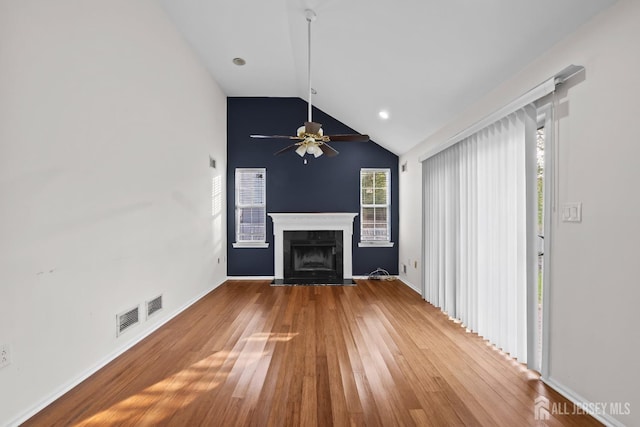26 Jaime Ct, Old Bridge, NJ 08857 - unfurnished living room featuring vaulted ceiling, wood finished floors, ceiling fan, and a fireplace