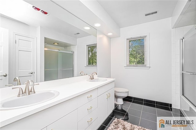5 Leighton Dr, East Brunswick, NJ 08816 - full bathroom with double vanity, tile patterned floors, and recessed lighting